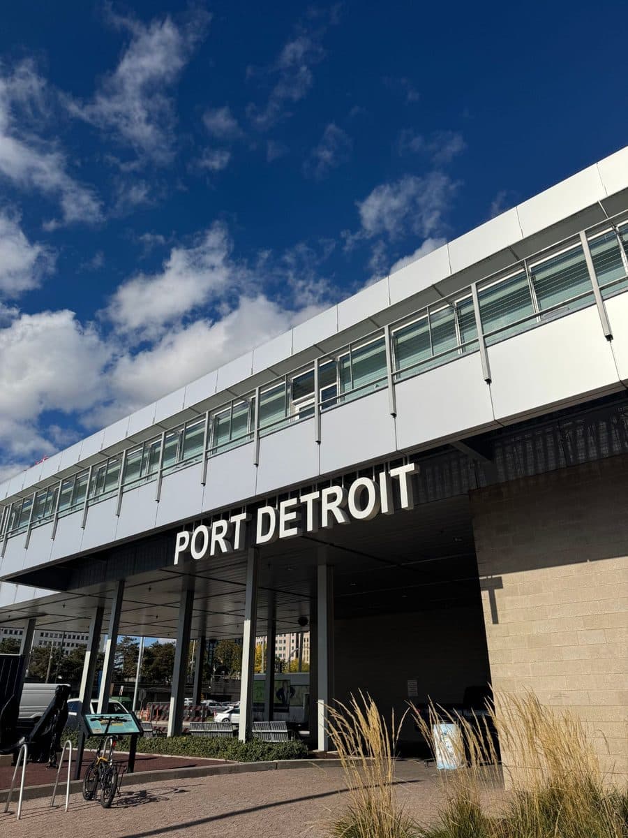 Port Detroit building sign under a blue sky