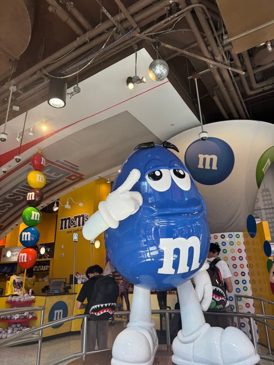 Giant blue M and M character statue inside the Times Square store