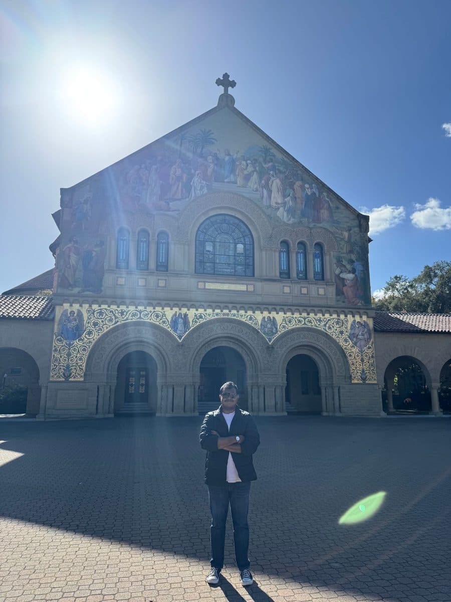 Vishanth in front of the mosaic facade of Stanford Memorial Church